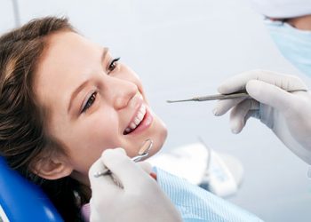 woman undergo dental implant